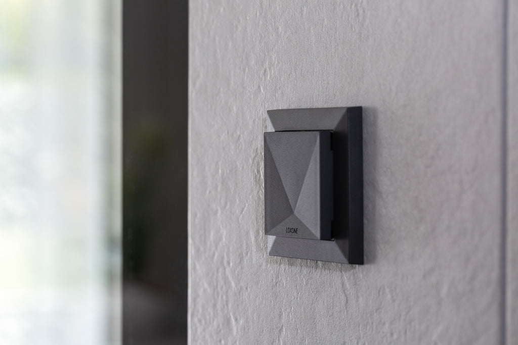 Loxone Room Comfort Sensor Tree in anthracite on a wall, close-up