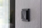 Loxone Room Comfort Sensor Tree in anthracite on a wall, close-up