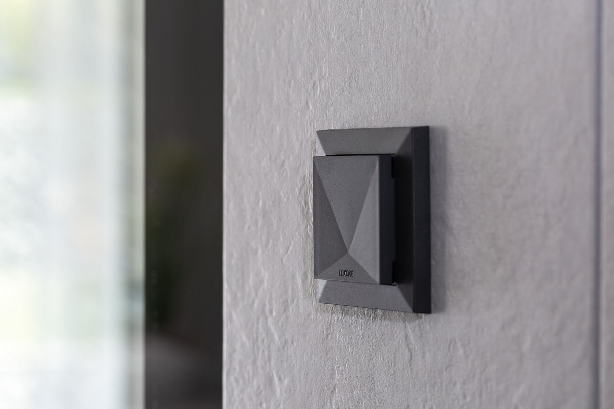 Loxone Room Comfort Sensor Tree in anthracite on a wall, close-up