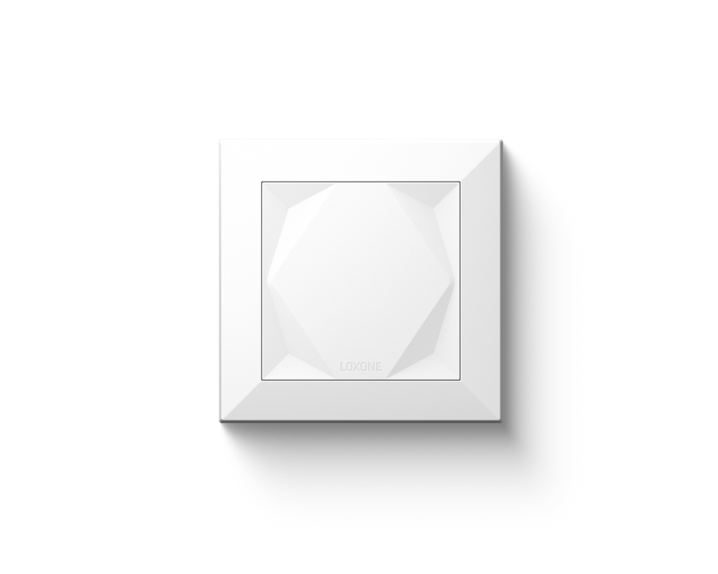 Loxone Touch wall switch in white with its faceted touch surface